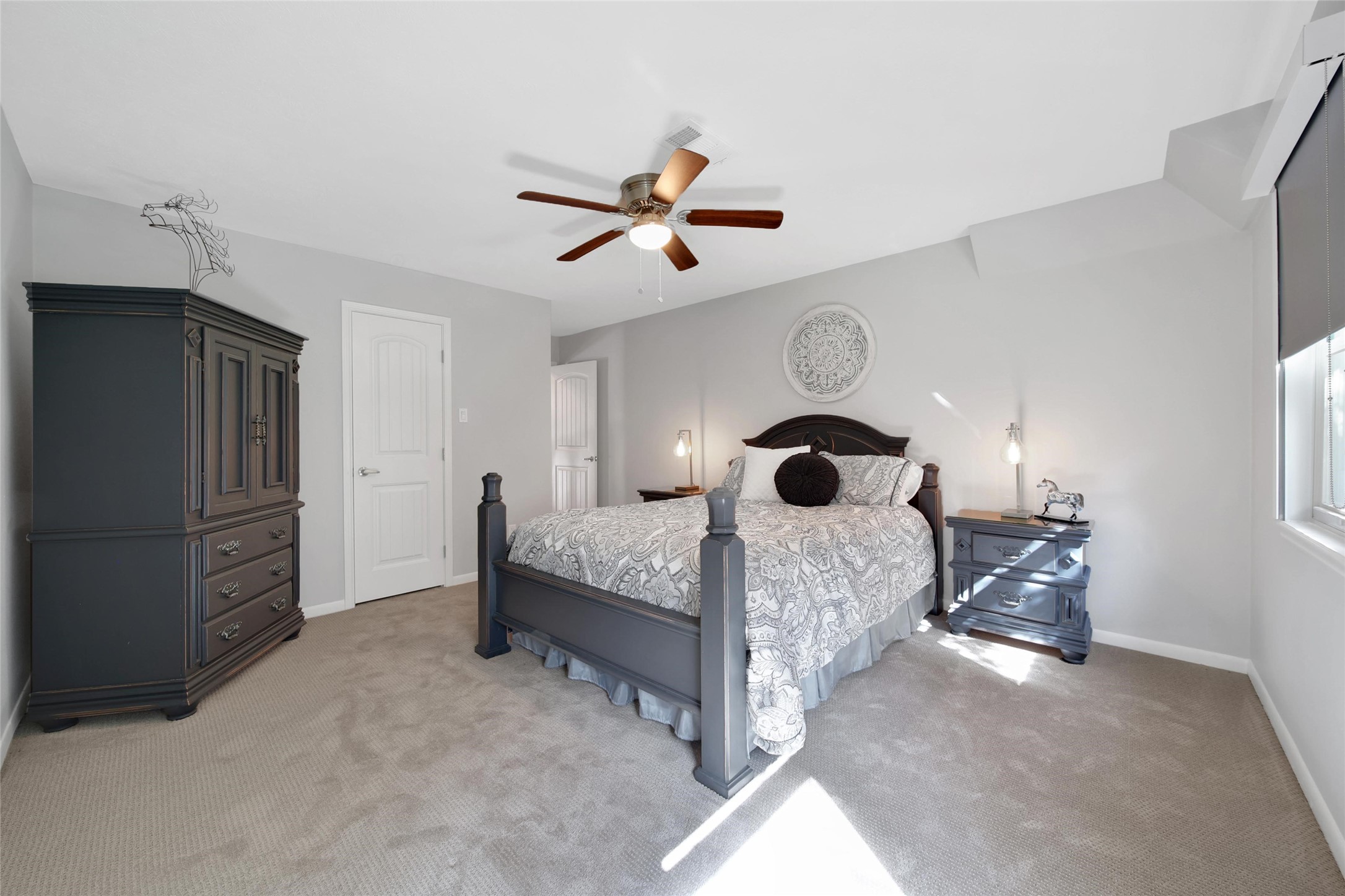 2902 Blue Lakes Lane Missouri City, TX 77459 - Photo 21 of 34 a bed room with a bed and a window