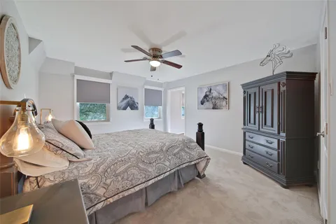 a bedroom with a bed dresser and a window