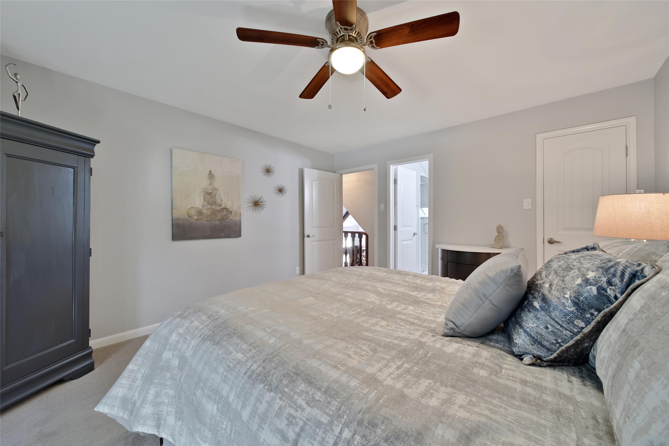 2902 Blue Lakes Lane Missouri City, TX 77459 - Photo 24 of 34 a bedroom with a large bed and a chandelier