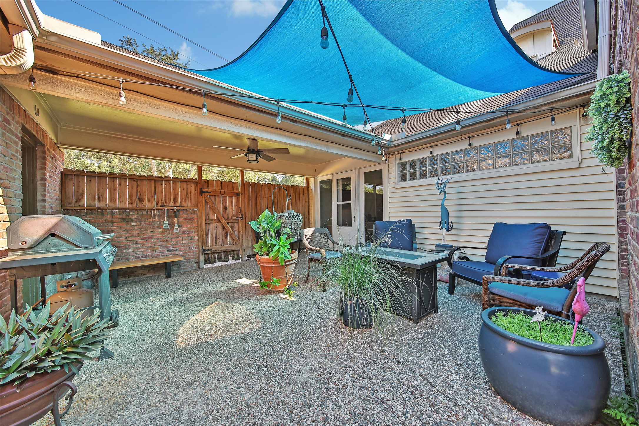2902 Blue Lakes Lane Missouri City, TX 77459 - Photo 25 of 34 a view of a backyard with plants and a patio