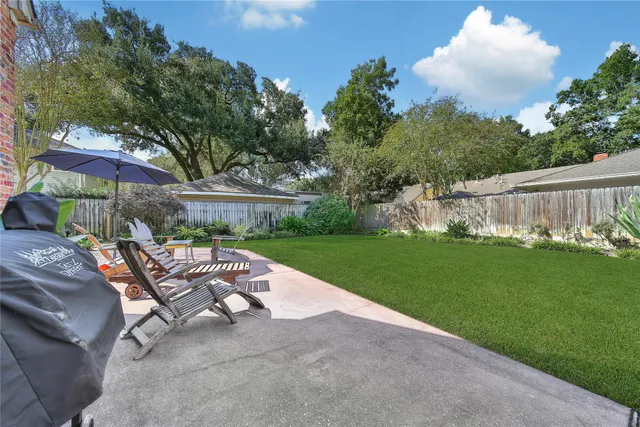 a view of a table and chairs in the garden