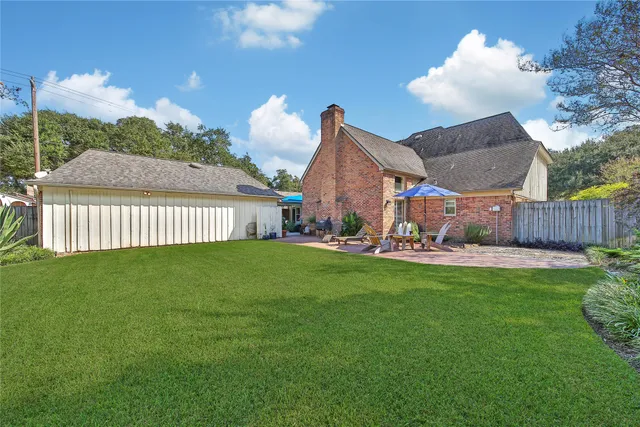 a view of an house with backyard and outdoor space