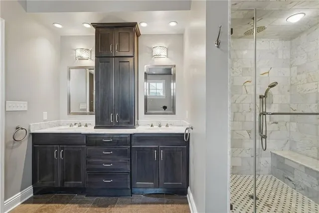 a bathroom with a granite countertop sink mirror and double