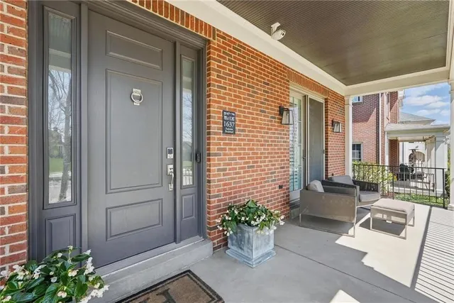 a front view of a house with chairs