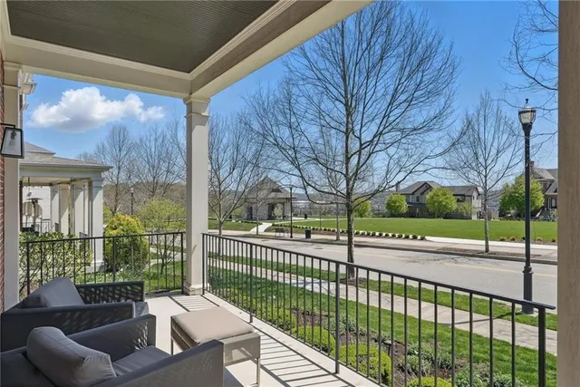 a view of a house with a large window and a floor to ceiling window