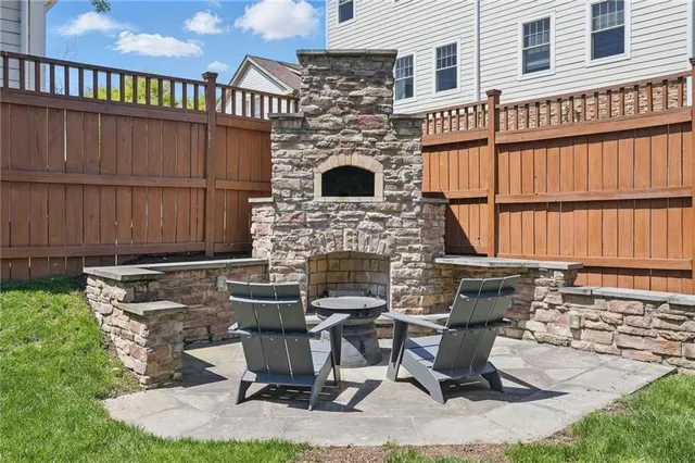 a view of a backyard with sitting area