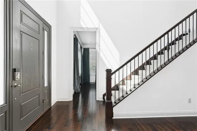 a view of staircase with wooden floor and staircase
