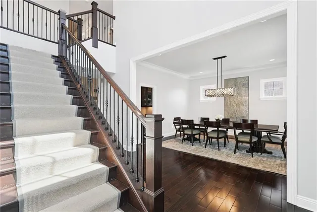 a view of dining room and hall with wooden floor
