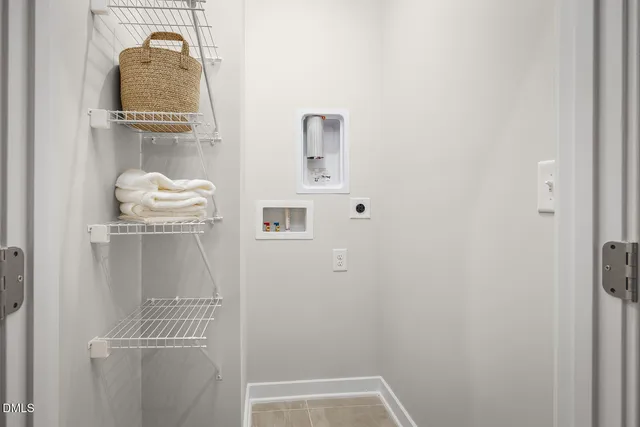 a view of a dining room with furniture and a window