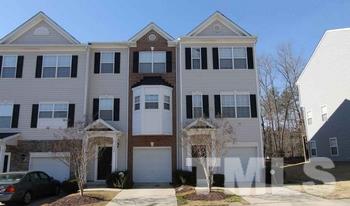 1666 Snow Mass Way Durham, NC 27713 - Photo 1 of 3 a front view of a house with a yard