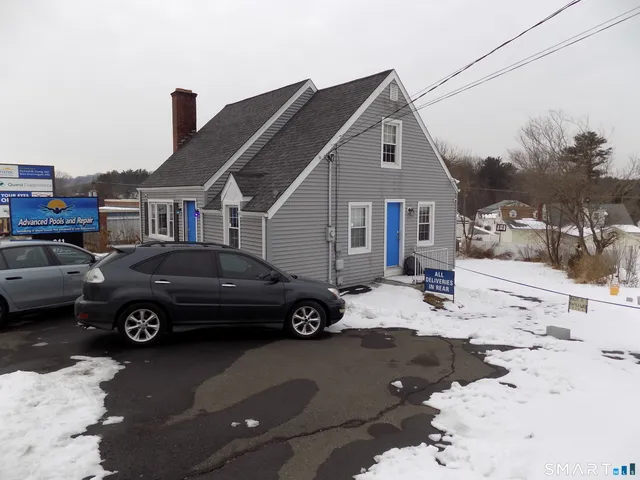 a car parked in front of a house