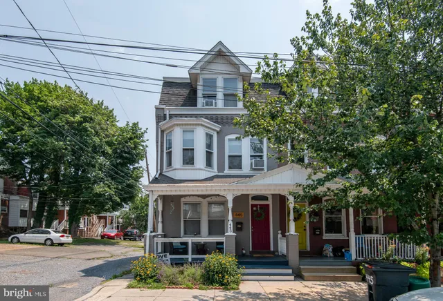 a front view of a building with street view