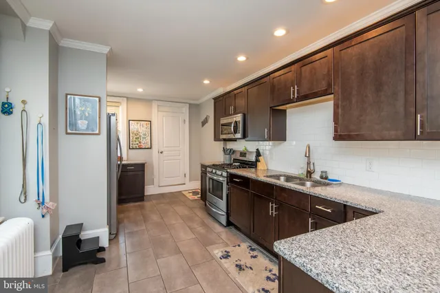 a kitchen with a stove and a microwave