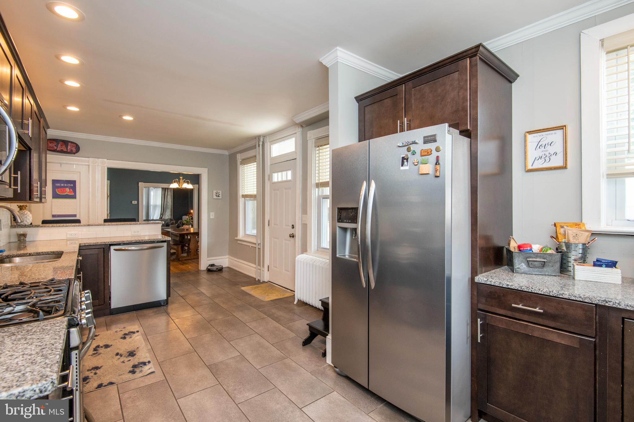 445 Nevin Street Lancaster, PA 17603 - Photo 16 of 53 a kitchen with stainless steel appliances granite countertop a refrigerator a sink a stove and a refrigerator