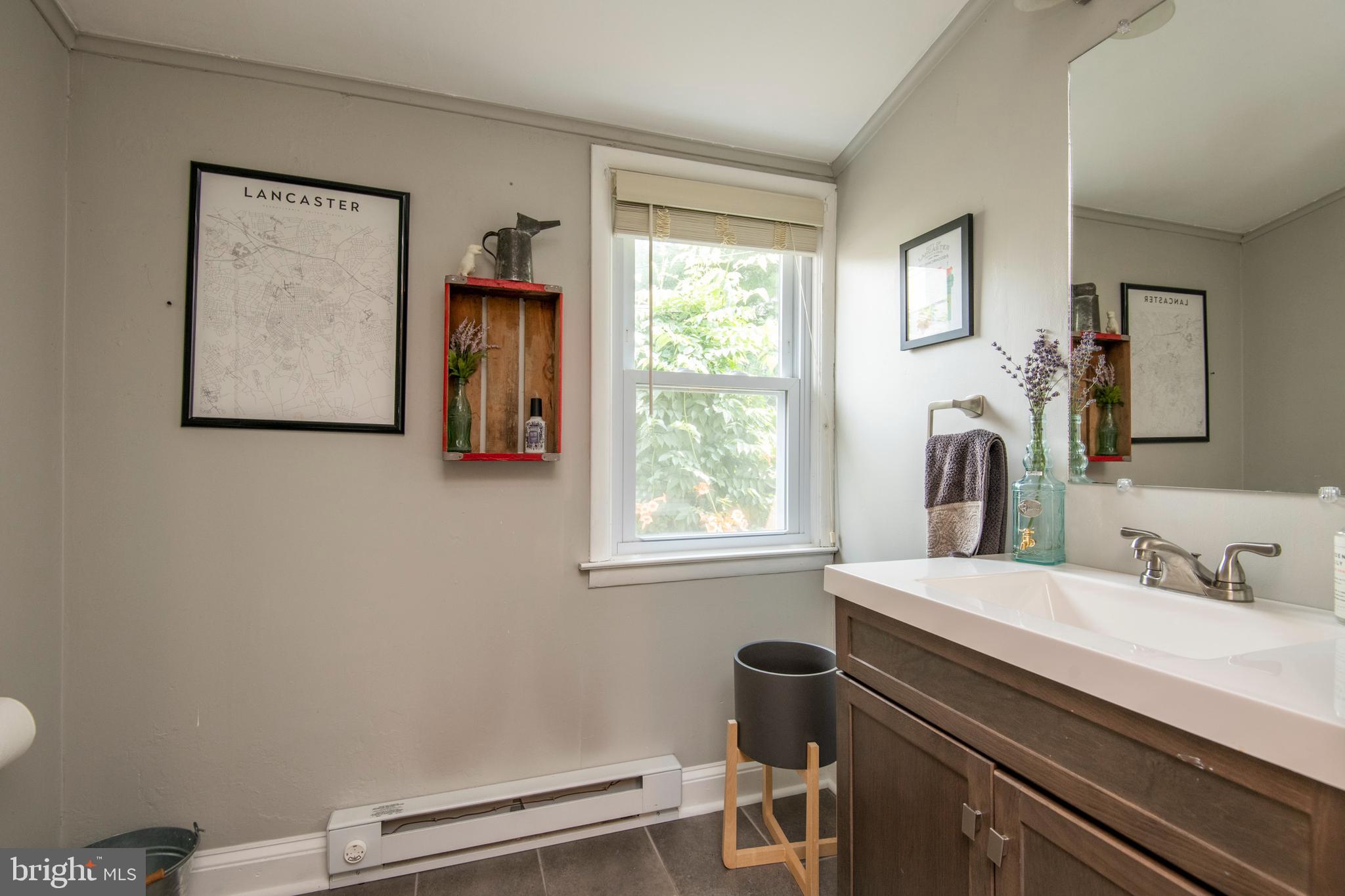 445 Nevin Street Lancaster, PA 17603 - Photo 18 of 53 a bathroom with a sink a toilet and a window
