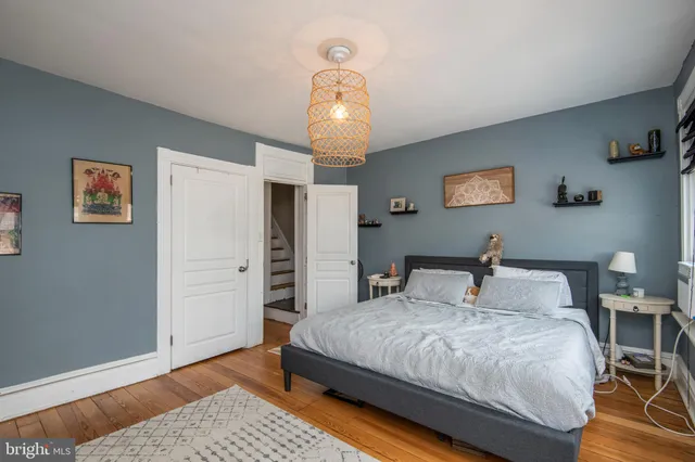 a bathroom with a granite countertop shower and a sink