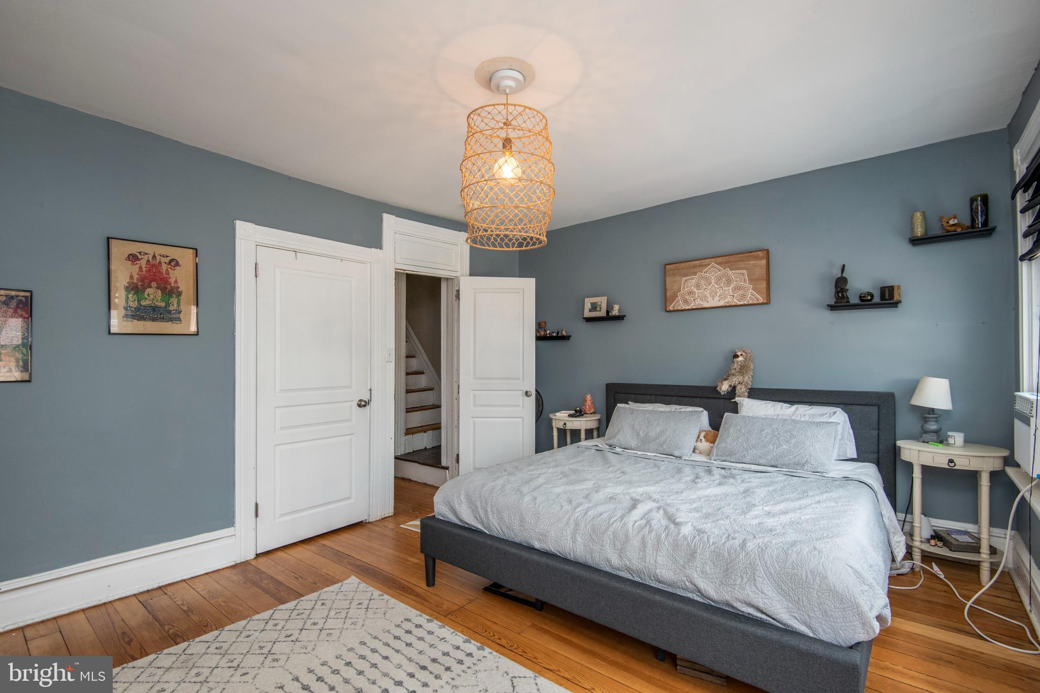 445 Nevin Street Lancaster, PA 17603 - Photo 22 of 53 a bedroom with a bed and wooden floor