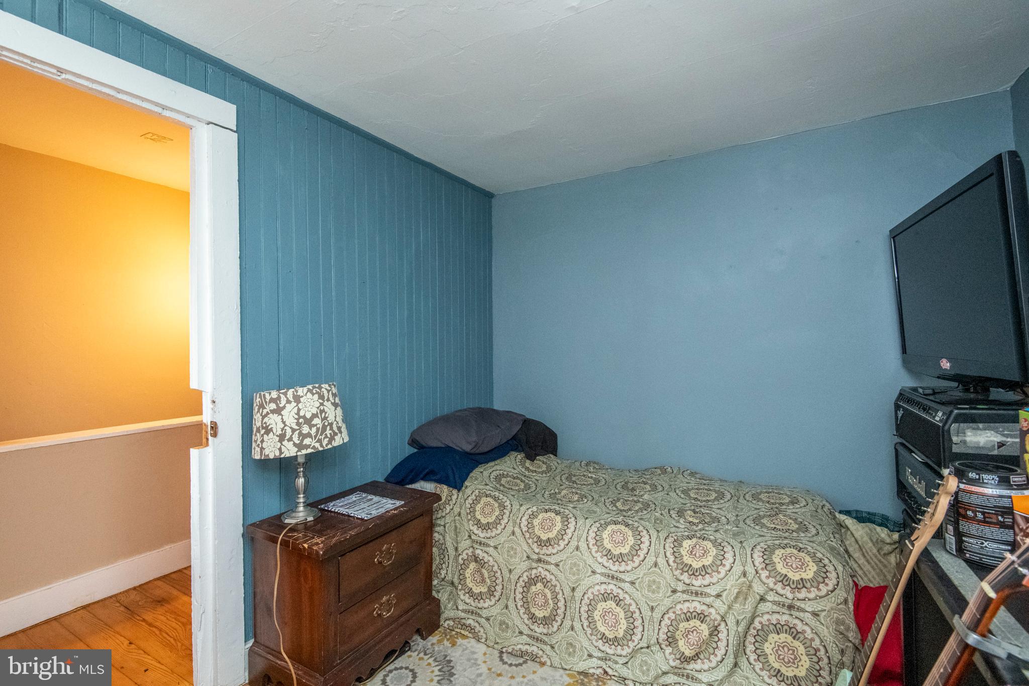 445 Nevin Street Lancaster, PA 17603 - Photo 32 of 53 a bedroom with a bed a flat tv screen and a window