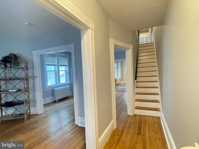 a kitchen with stainless steel appliances granite countertop a sink and a refrigerator