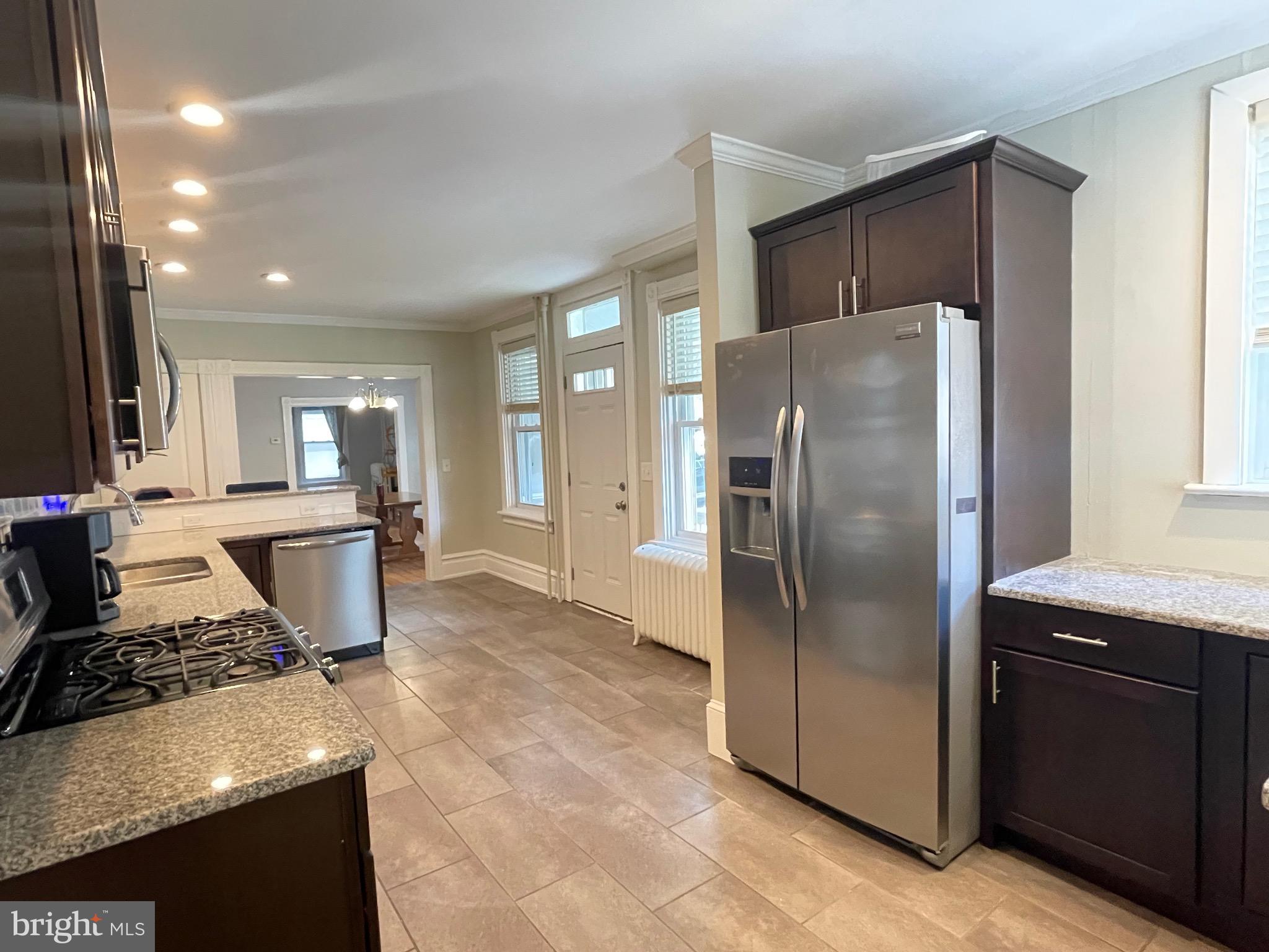 445 Nevin Street Lancaster, PA 17603 - Photo 46 of 53 a kitchen with stainless steel appliances granite countertop a refrigerator and a stove