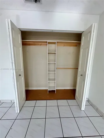 a view of an empty walk in closet