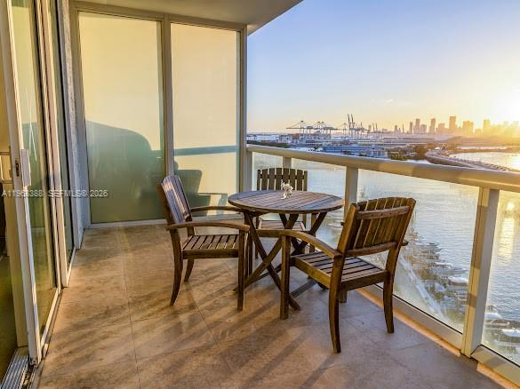 450 Alton Road, Unit 1202 Miami Beach, FL 33139 - Photo 8 of 68 a view of a balcony with furniture and front door