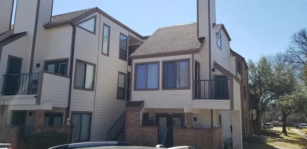 a front view of a house with yard