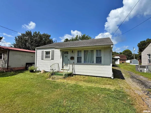 a view of a house with a yard porch and sitting area