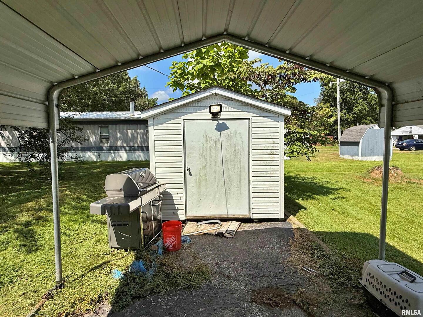 1603 Ferry Street Metropolis, IL 62960 - Photo 22 of 26 a backyard of a house with table and chairs