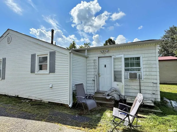 a front view of a house with patio