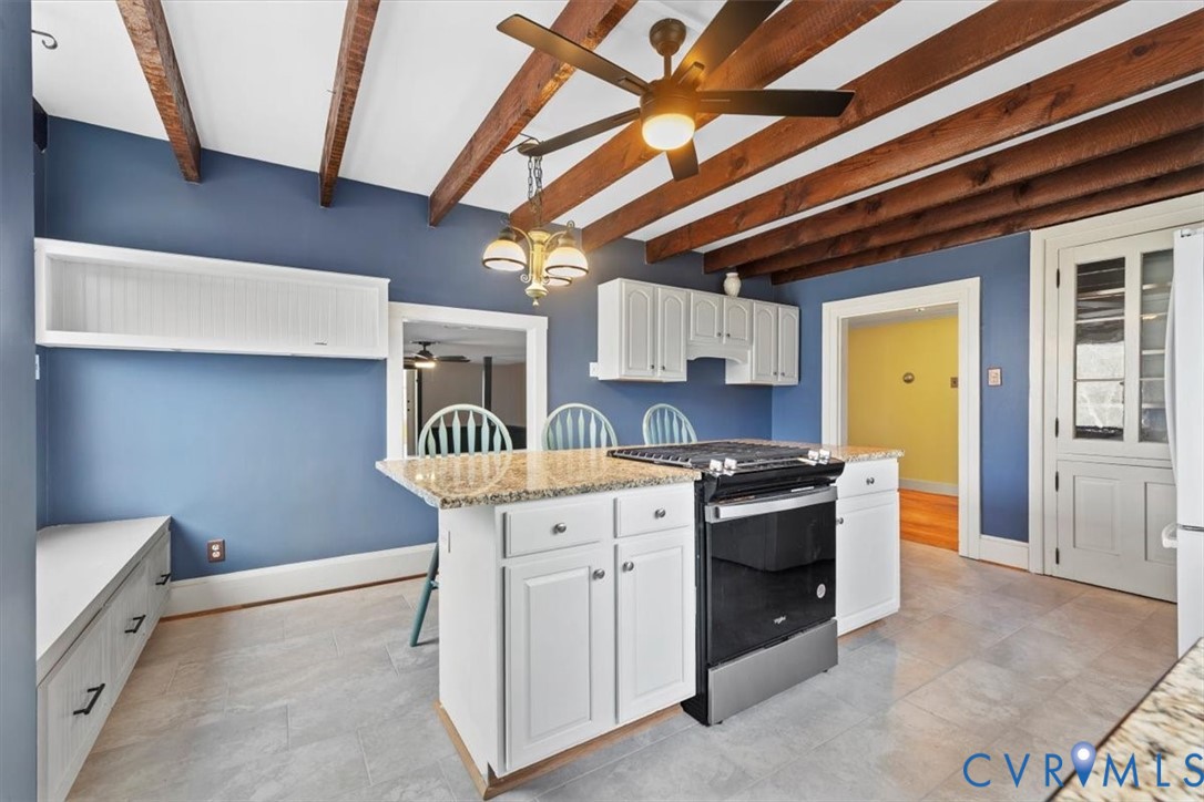 2297 Indian Oak Road Crewe, VA 23930 - Photo 11 of 49 a kitchen with stainless steel appliances granite countertop a stove a sink and a microwave