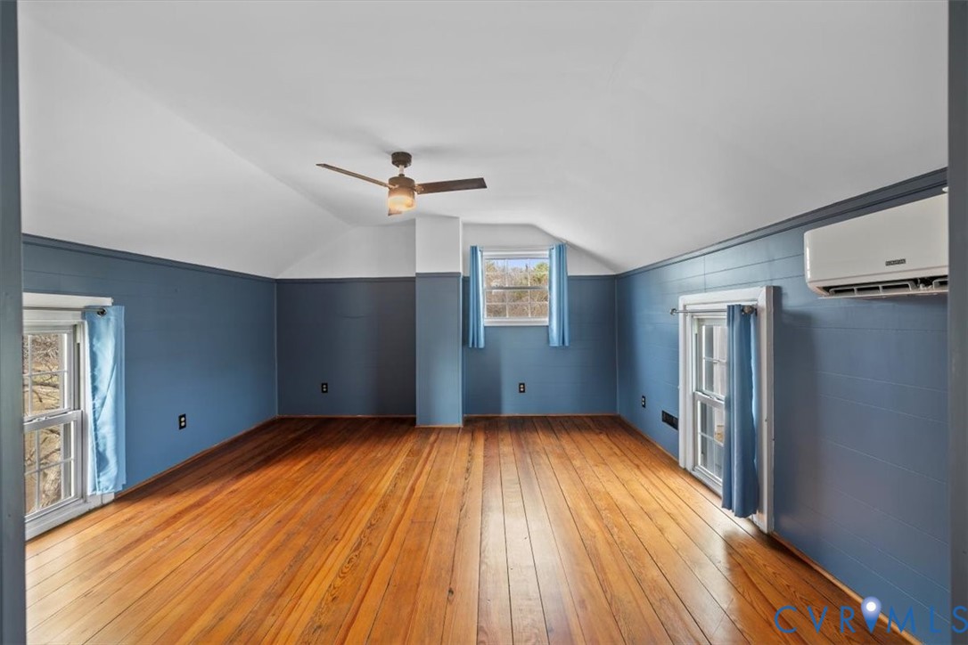 2297 Indian Oak Road Crewe, VA 23930 - Photo 29 of 49 a view of a livingroom with a ceiling fan window and wooden floor