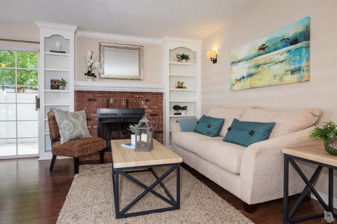 1940 Rory Lane, Unit 5 Simi Valley, CA 93063 - Photo 1 of 19 a living room with furniture and a fireplace
