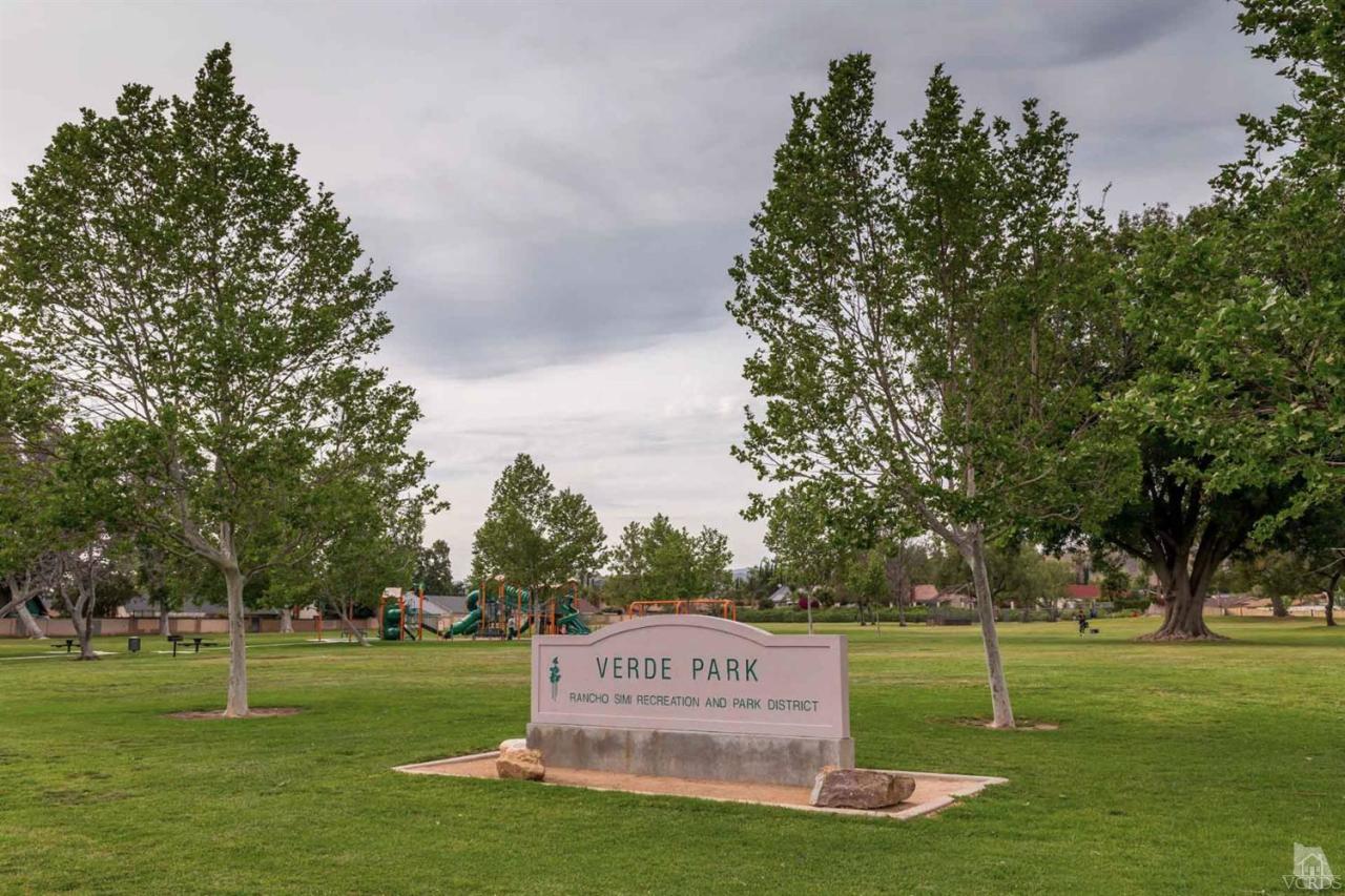 1940 Rory Lane, Unit 5 Simi Valley, CA 93063 - Photo 17 of 19 a sign board with tall trees in the background