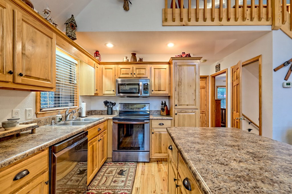 36 Prairie Crossing Murphy, NC 28906 - Photo 20 of 71 a kitchen with stainless steel appliances granite countertop a sink stove and refrigerator