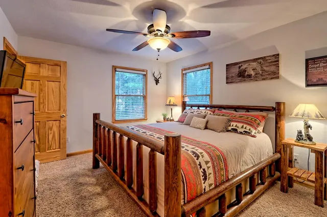 a view of yard from deck with patio