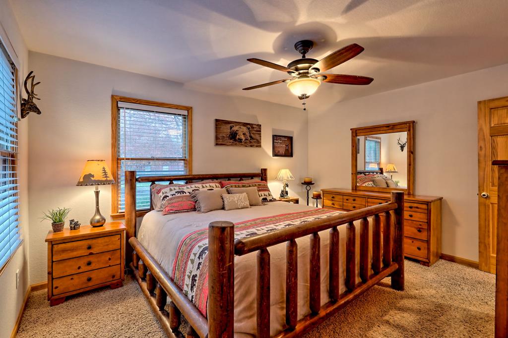 36 Prairie Crossing Murphy, NC 28906 - Photo 36 of 71 a bedroom with bed and a chandelier