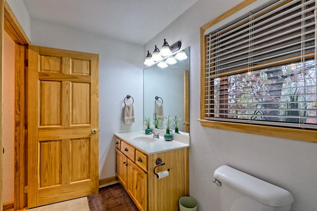 36 Prairie Crossing Murphy, NC 28906 - Photo 39 of 71 a bathroom with a sink a mirror and a toilet