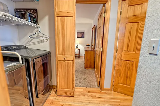 a bedroom with a bed and a table in it