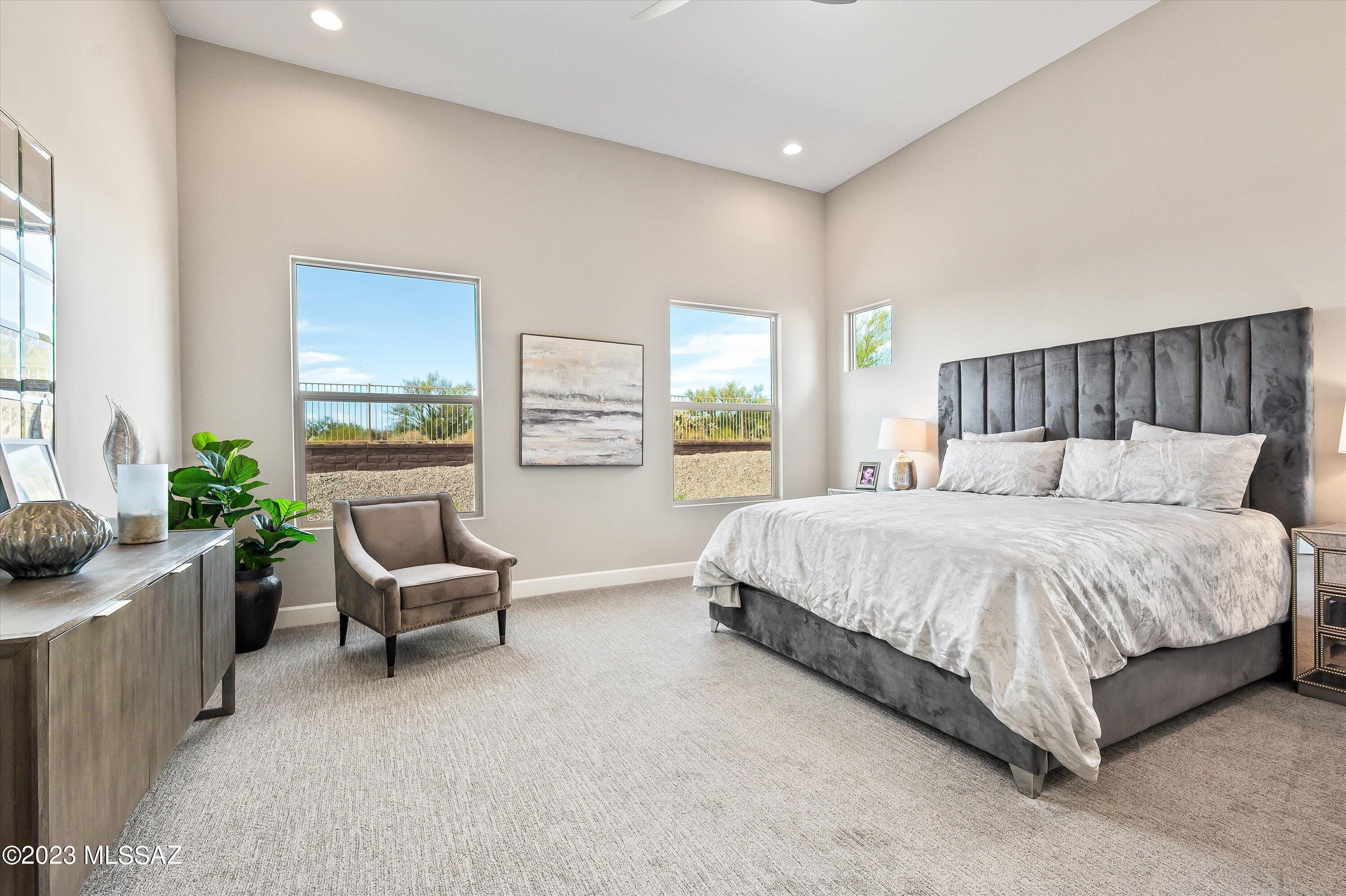 13169 North Vistoso Rnch Place Oro Valley, AZ 85755 - Photo 15 of 29 a bed sitting in a spacious bedroom next to a window