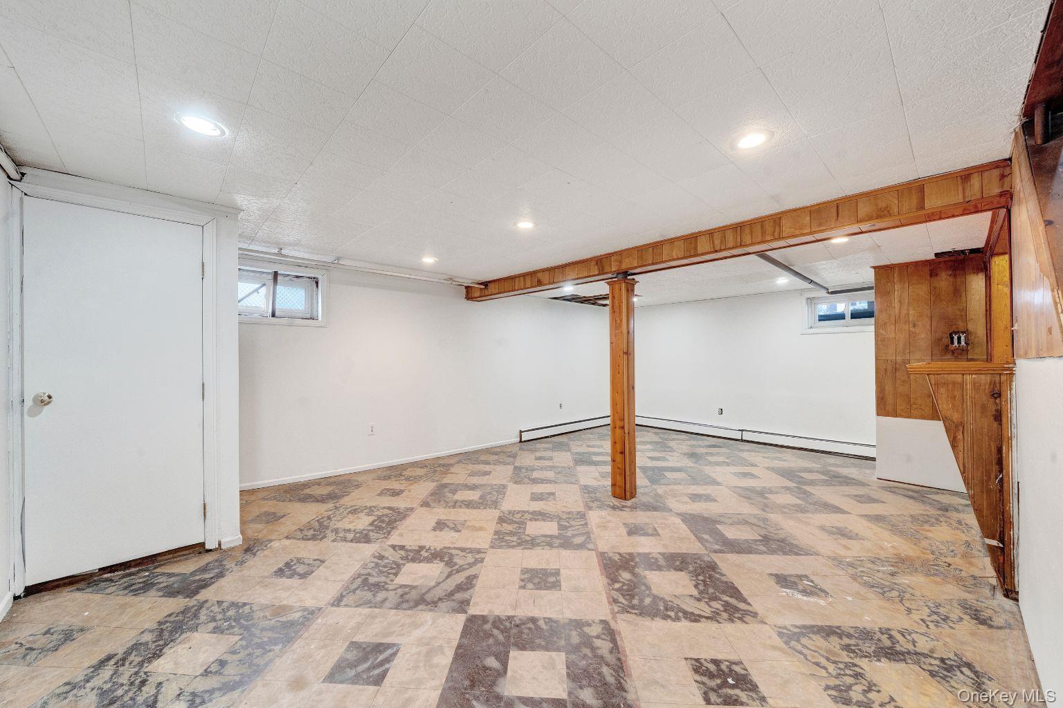 450 Rhodes Lane West Hempstead, NY 11552 - Photo 14 of 16 Addition view of finished masement highlighting layout and useable square footage.