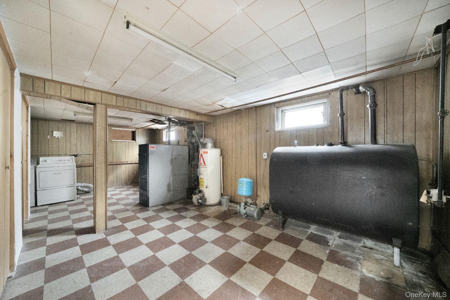 450 Rhodes Lane West Hempstead, NY 11552 - Photo 15 of 16 Utility Room area with mechanical systems and storage space.