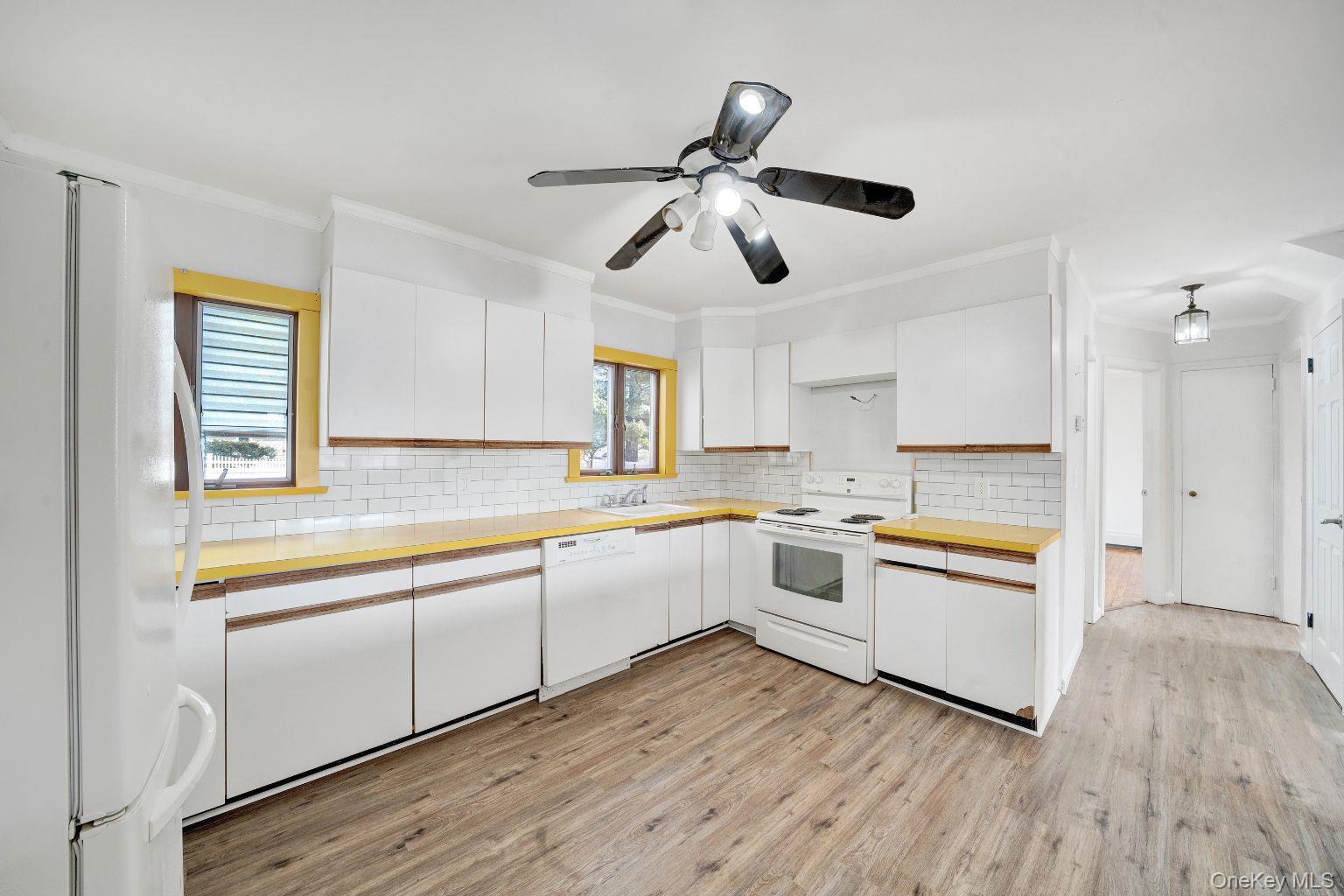 450 Rhodes Lane West Hempstead, NY 11552 - Photo 9 of 16 Kitchen with full appliance setup, ample cabinetry and counter space.