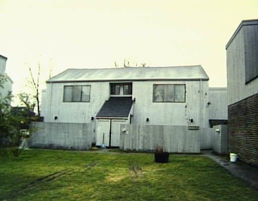 a view of a house with a yard and plants