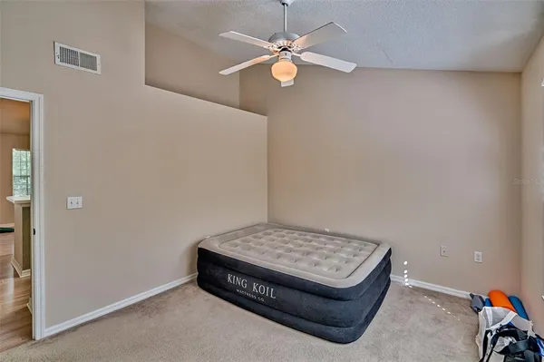 an empty room with fan