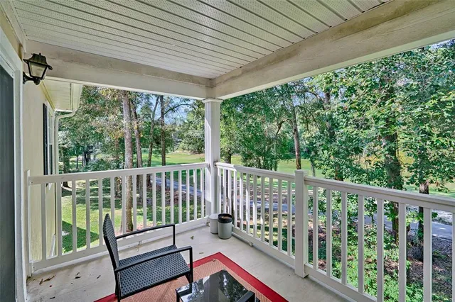 a view of a two chairs in the balcony