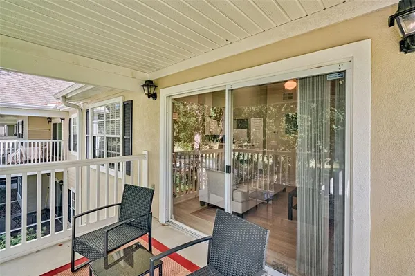 a view of a porch with wooden floor