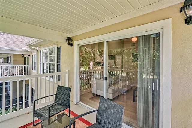 a view of a porch with wooden floor