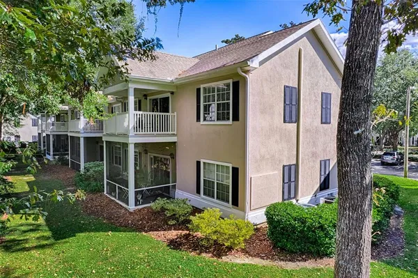 a view of a house with brick walls and a large windows