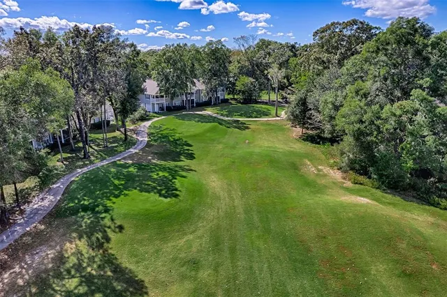 a view of a big yard with green space